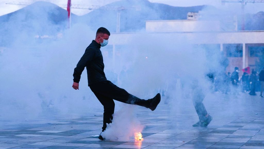 Riot police using water cannons and tear gas against protesters in Tirana, Albania