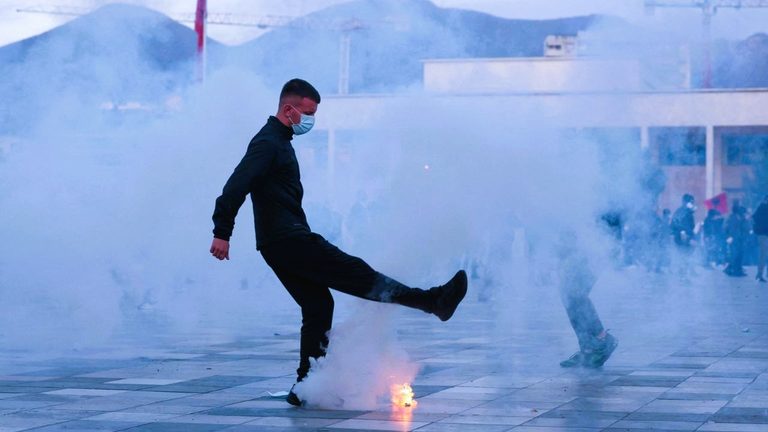 Riot police using water cannons and tear gas against protesters in Tirana, Albania