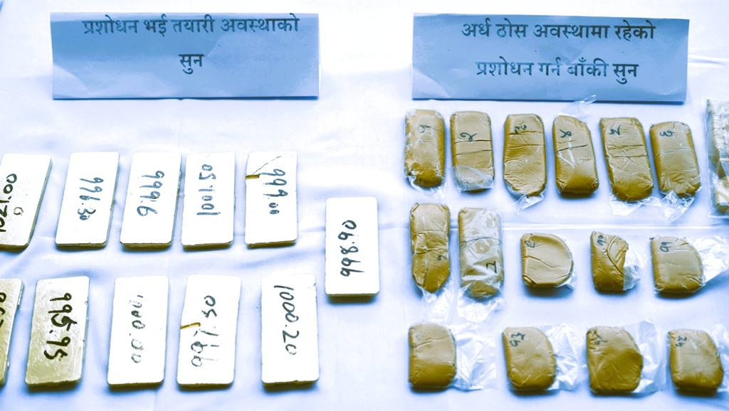Seized gold bars, molten gold samples, and equipment recovered from the Budhanilkantha raid displayed by Kathmandu Crime Investigation Office