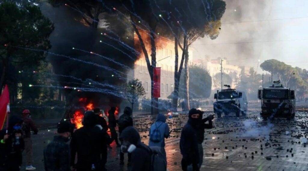 Riot police using water cannons and tear gas against anti-government demonstrators near the Education Ministry in Tirana, Albania