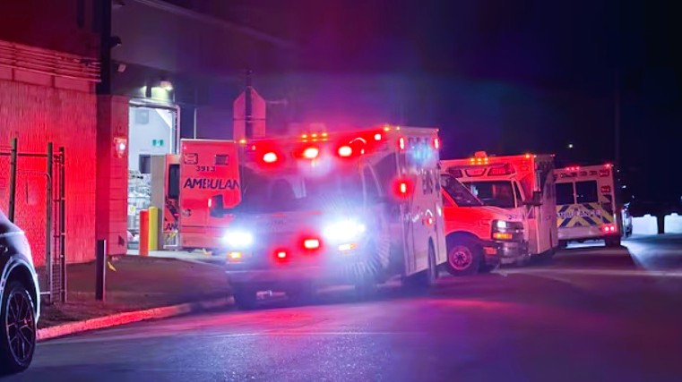 Emergency service vehicles deployed near the entrance of Canadian Forces Base Wainwright in Alberta following a major fire
