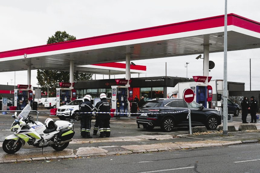 French police cordoning off the street following a drive-by shooting in a Paris suburb