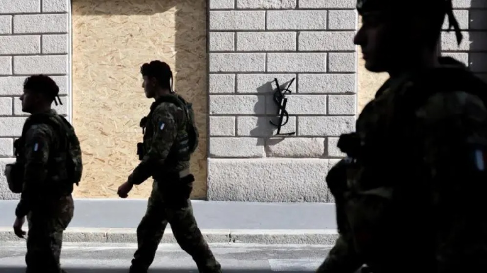 French riot police officers standing guard near Place de la République in Paris during high-security deployments