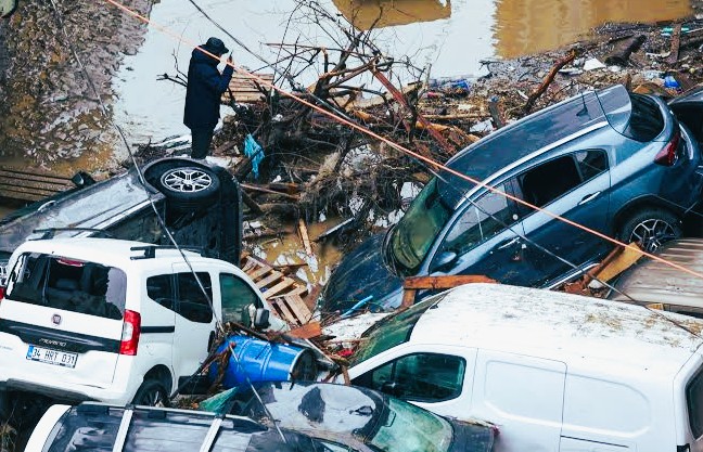 Emergency rescue personnel deploying inflatable boats along a flooded street in Istanbul following record rainfall