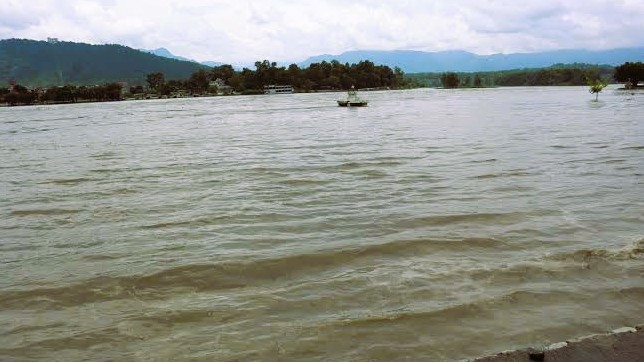 Nepal Police disaster rescue personnel conducting a boat search operation on the Narayani River in Chitwan