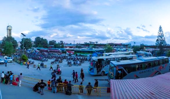 Crowded Gongabu New Bus Park in Kathmandu with long-distance passenger buses preparing for Dashain travel