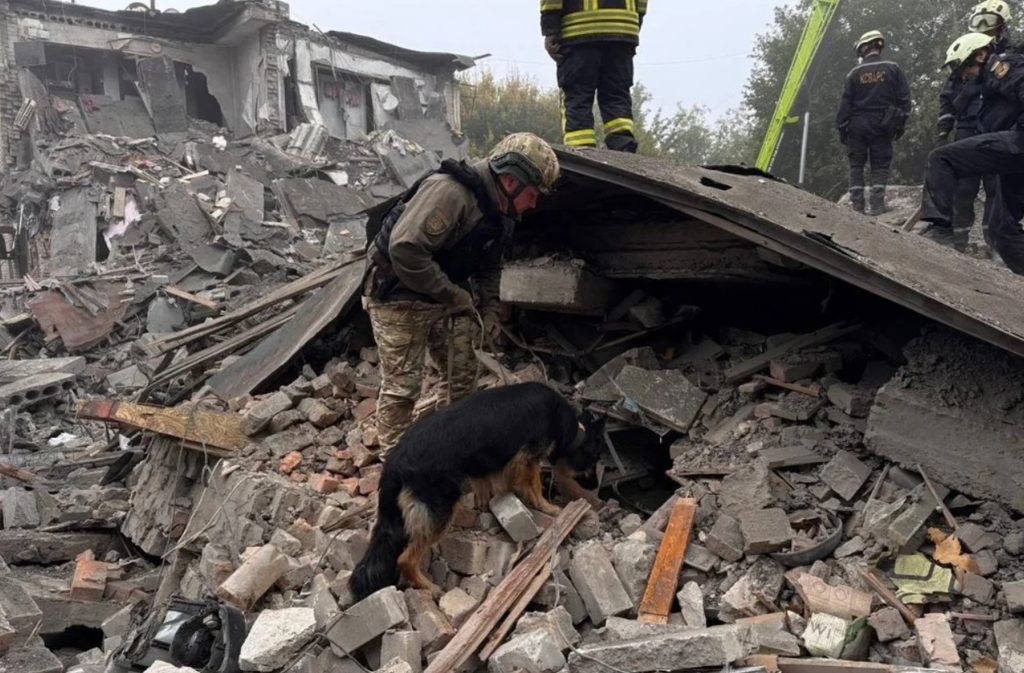 Emergency rescue teams searching through the collapsed remains of a five-story apartment block in Zaporizhzhia following a Russian glide bomb attack