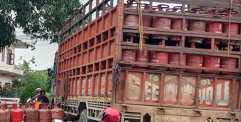 Consumers exchanging LPG gas cylinders at a designated Nepal Oil Corporation distribution center in Kathmandu