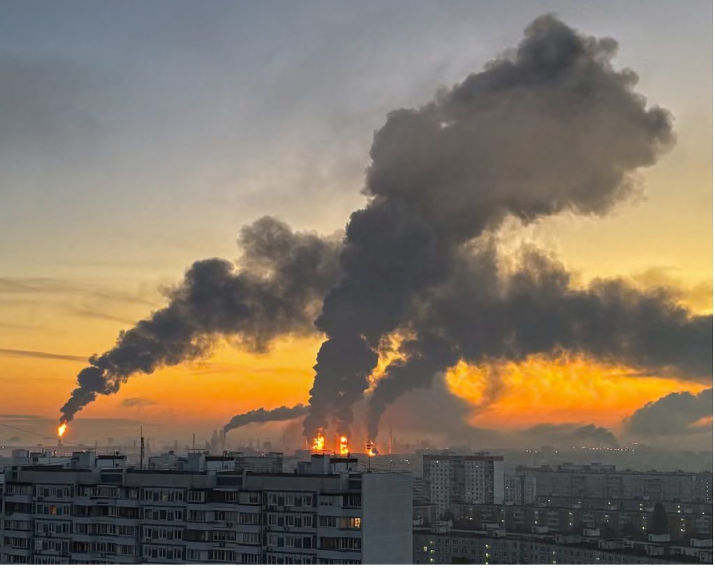 Smoke rising from a Russian oil refinery following a long-range Ukrainian drone strike amid global energy market concerns