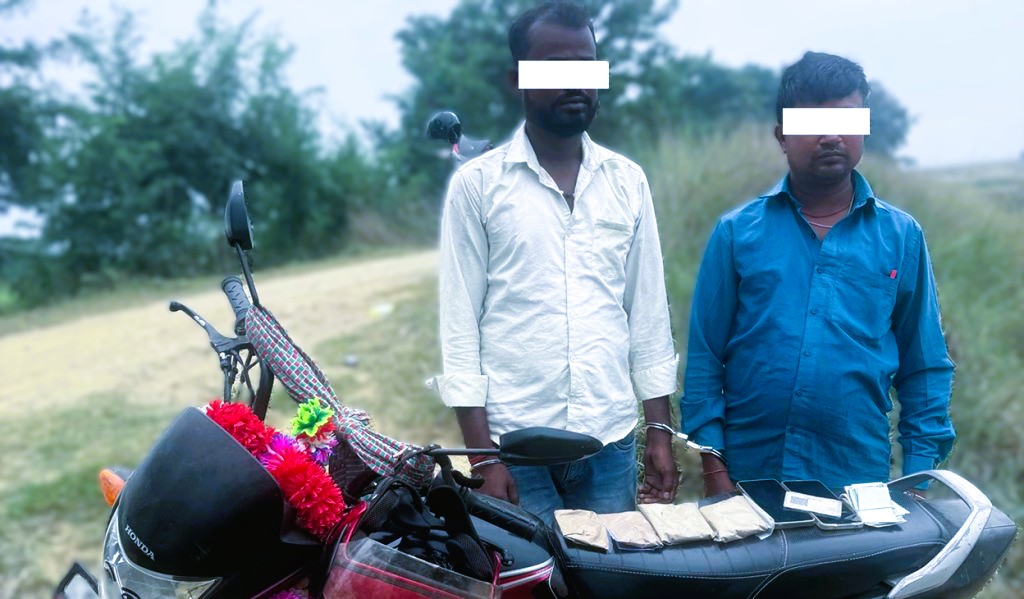 Nepal Police Narcotics Control Bureau officers displaying seized brown heroin and motorcycle in Siraha
