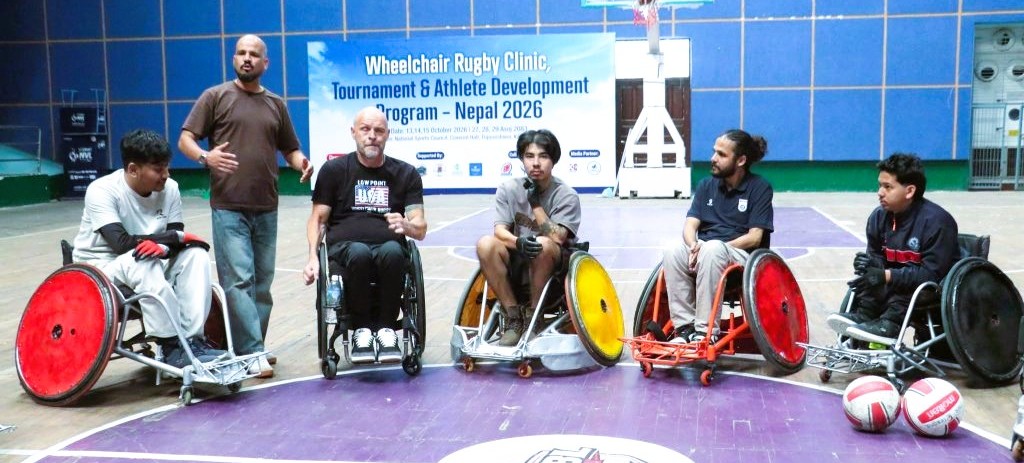 Nepali adaptive athletes undergoing wheelchair rugby maneuvering drills with international coaches at the NSC Covered Hall in Tripureshwor, Kathmandu